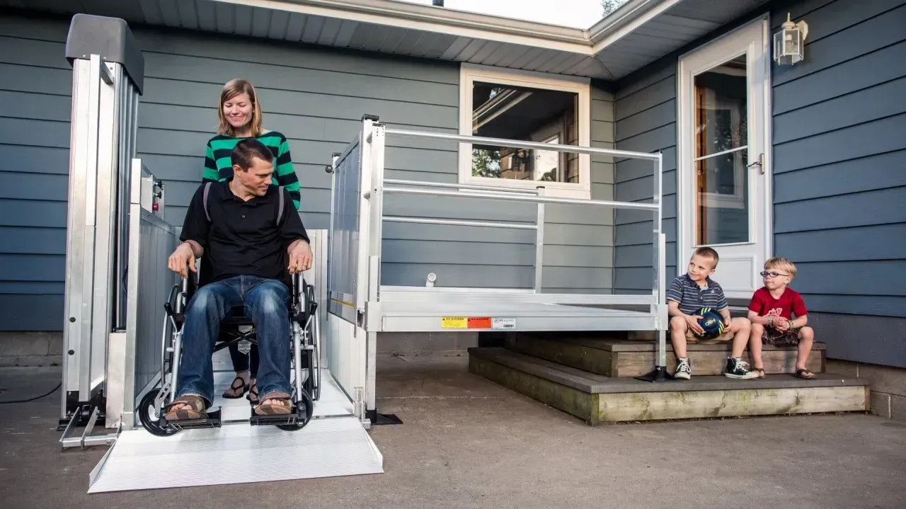 Veteran using a vertical platform lift at home for improved accessibility and safety