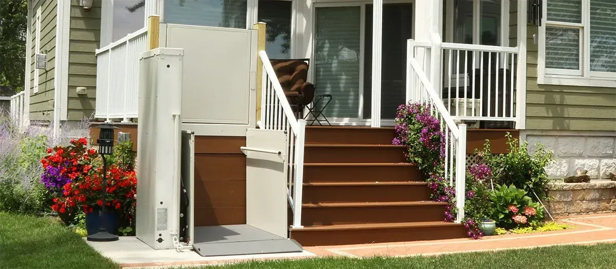 A house with a wheelchair lift on the front porch.