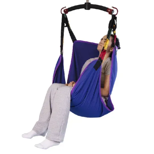 A person is sitting in a blue sling on a white background