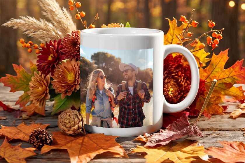 A white coffee mug with a picture of a man and a woman on it