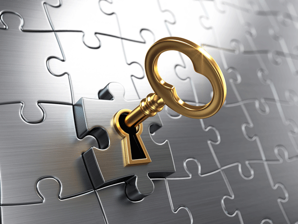 Key inserted in a puzzle piece