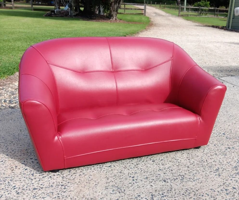 A Red Leather Loveseat on a Concrete — Cupitt's Quality Upholstery in Rous, NSW