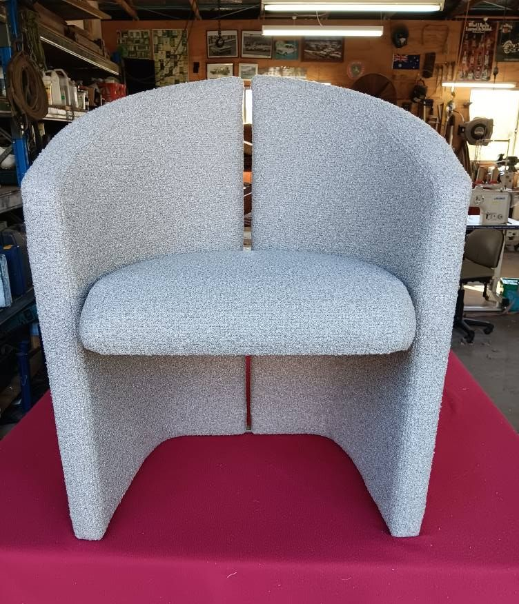 A Upholstered Light Gray Chair on a Red Table, in a Workshop — Cupitt's Quality Upholstery in Rous, NSW