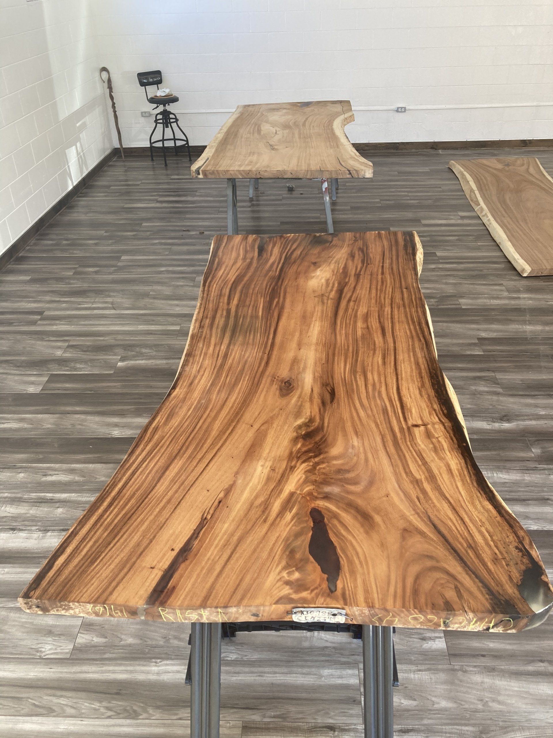 A wooden table is sitting on top of a wooden floor in a room.