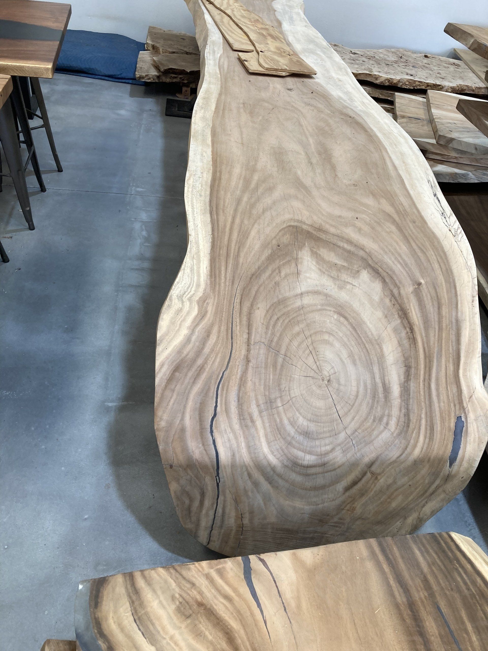 A large piece of wood is sitting on top of a table.
