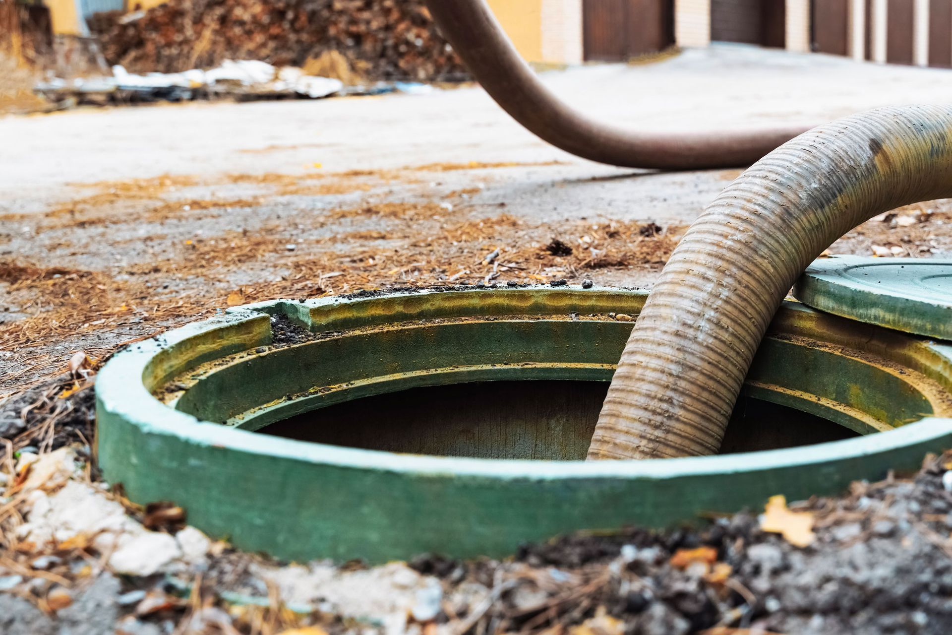 Pipe in septic tank highlighting reliable septic system pumping and safe sewage removal service.