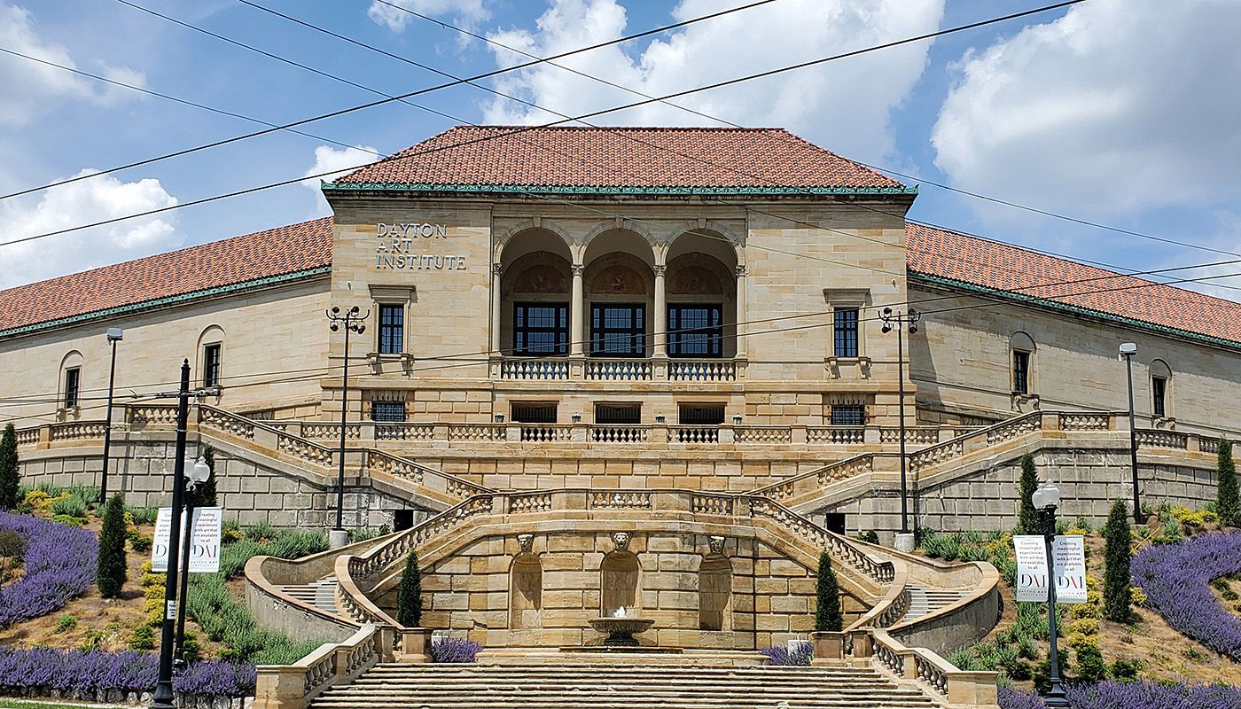 A large stone building with stairs leading up to it.