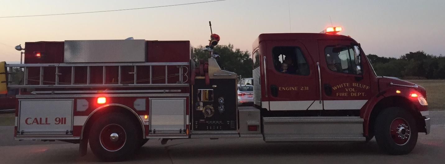 A fire truck is parked on the side of the road