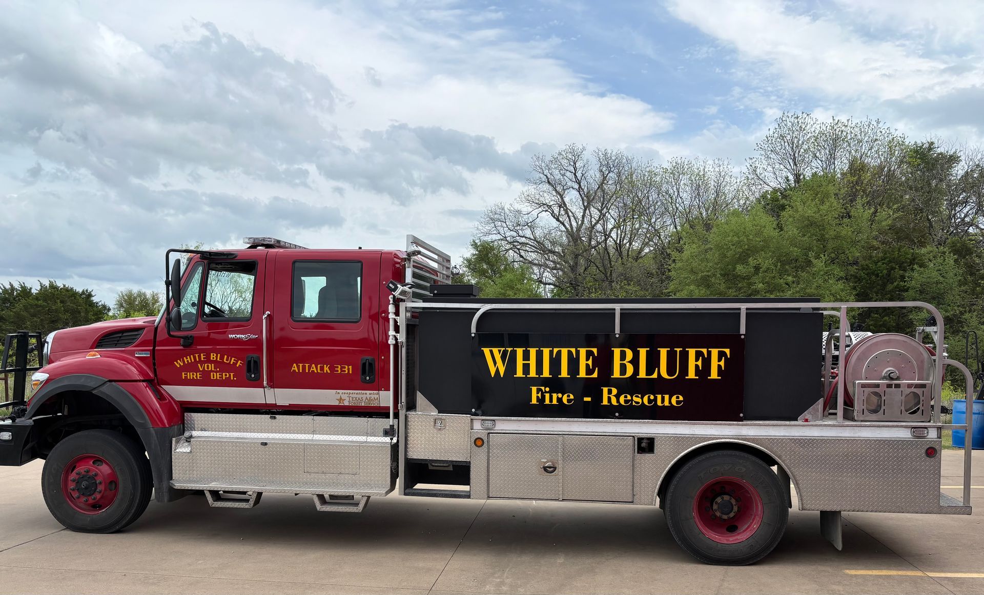 A red fire truck is parked on the side of the road