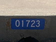 A blue sticker with the numbers 01723 on it