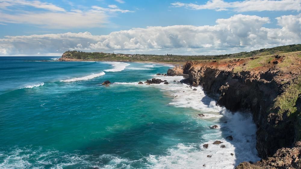 A Cliff Overlooking the Ocean With Waves Crashing on the Shore — 4WD Slashing & Large Area Mowing In Lennox Head, NSW