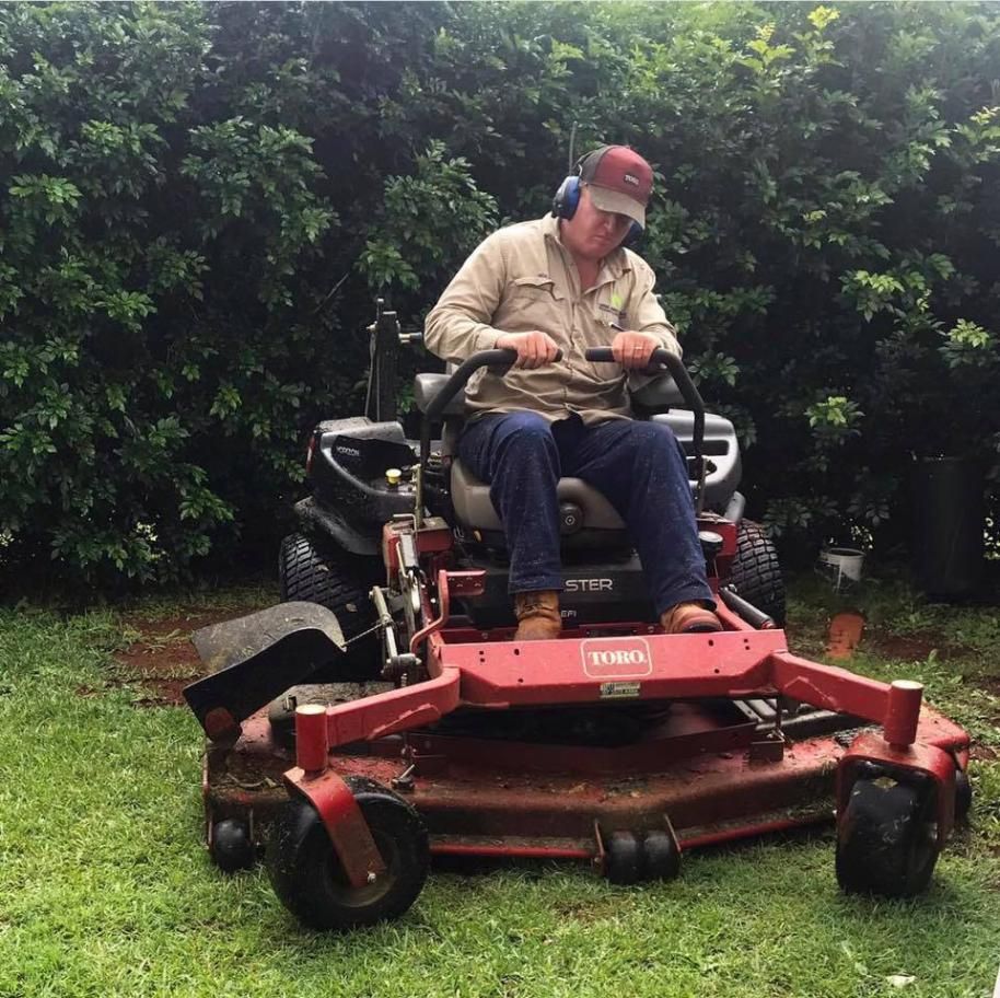 A Man is Sitting on a Toro Lawn Mower — 4WD Slashing & Large Area Mowing In Lennox Head, NSW