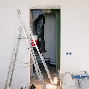 Man doing house interior restoration Man doing house interior restoration