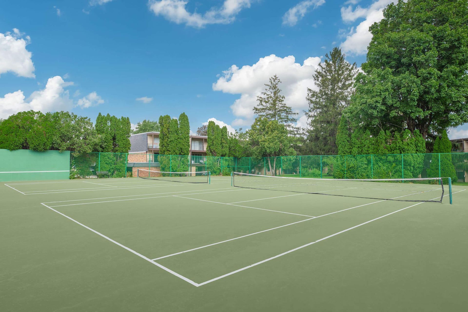 Multiple tennis courts at the Homewood Manor apartments in Moline, IL