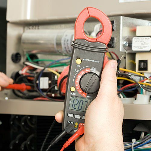 Repairman Checks Voltage | Sturgis, MI | Prime Quality Electric, LLC