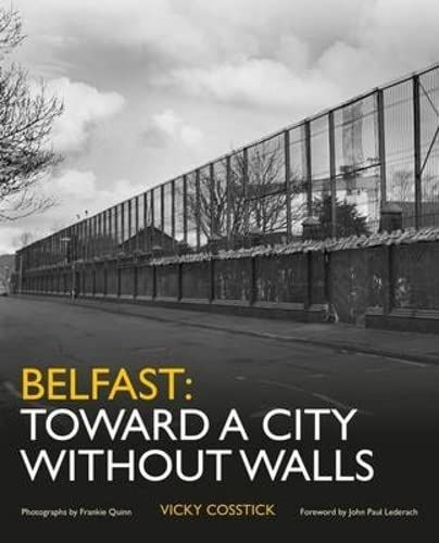 Belfast poster showing a long divided wall, titled “Toward a City Without Walls,” in black and yellow.