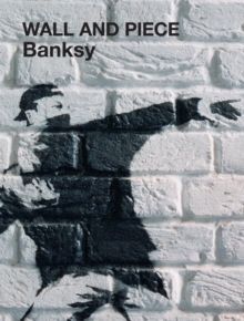 Banksy stencil on a brick wall with the text “WALL AND PIECE” in black and white