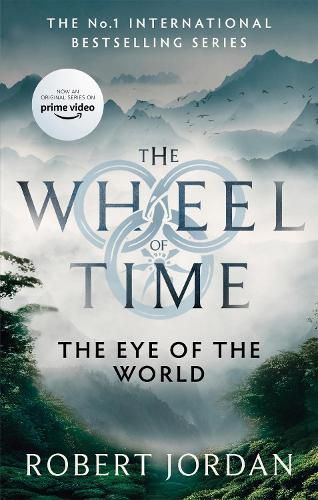 Book cover for The Eye of the World by Robert Jordan, with misty mountains and a forest scene