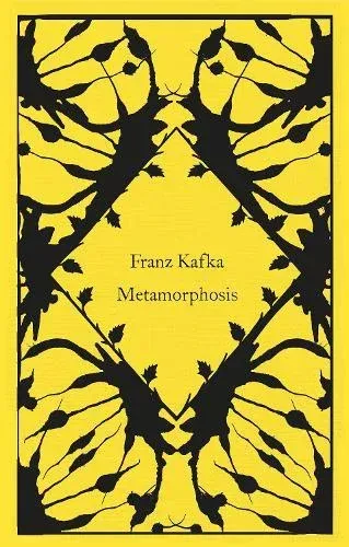 Yellow book cover with black insect-like symmetrical design, titled 