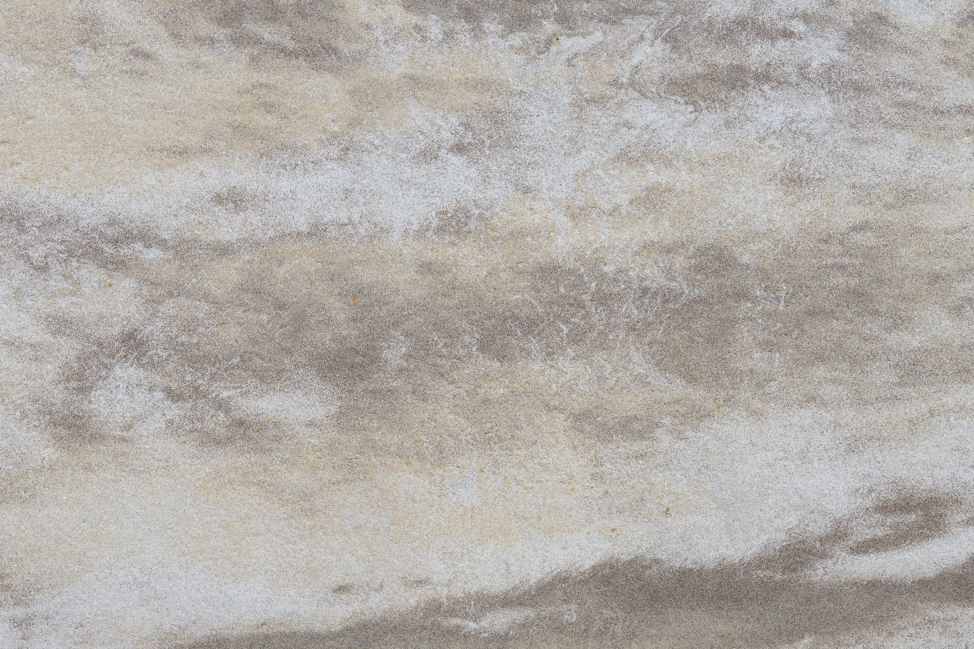 Tan and brown marbled stone texture.