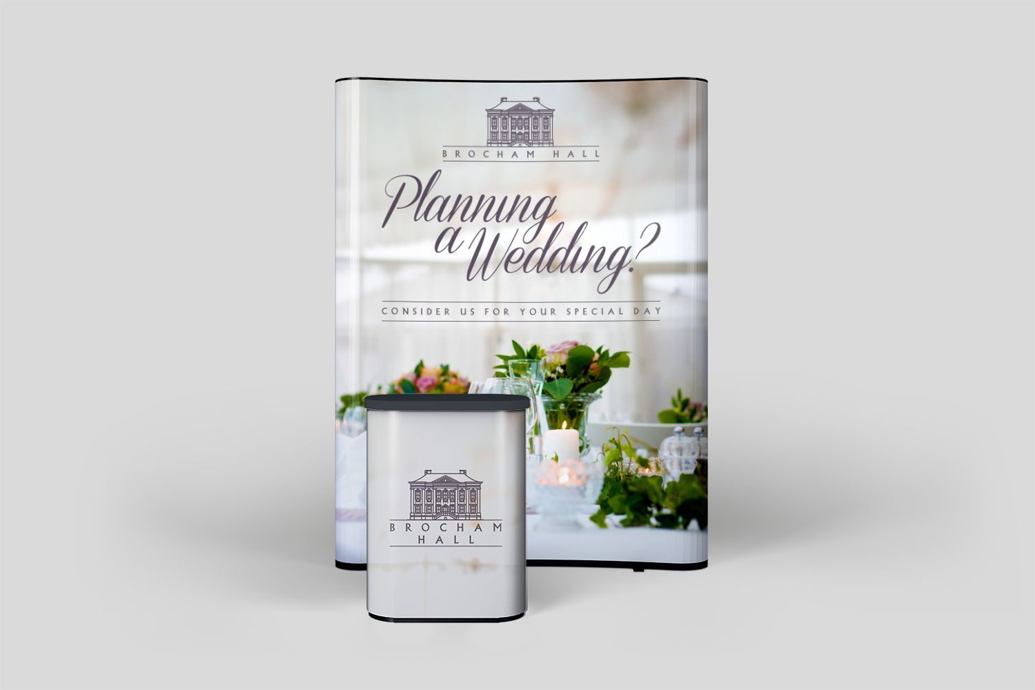 A sign that says `` planning a wedding '' is sitting on top of a table.