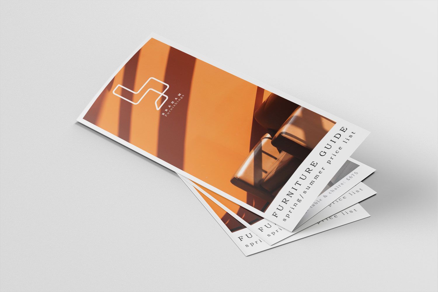A brochure for a furniture store is stacked on top of each other.