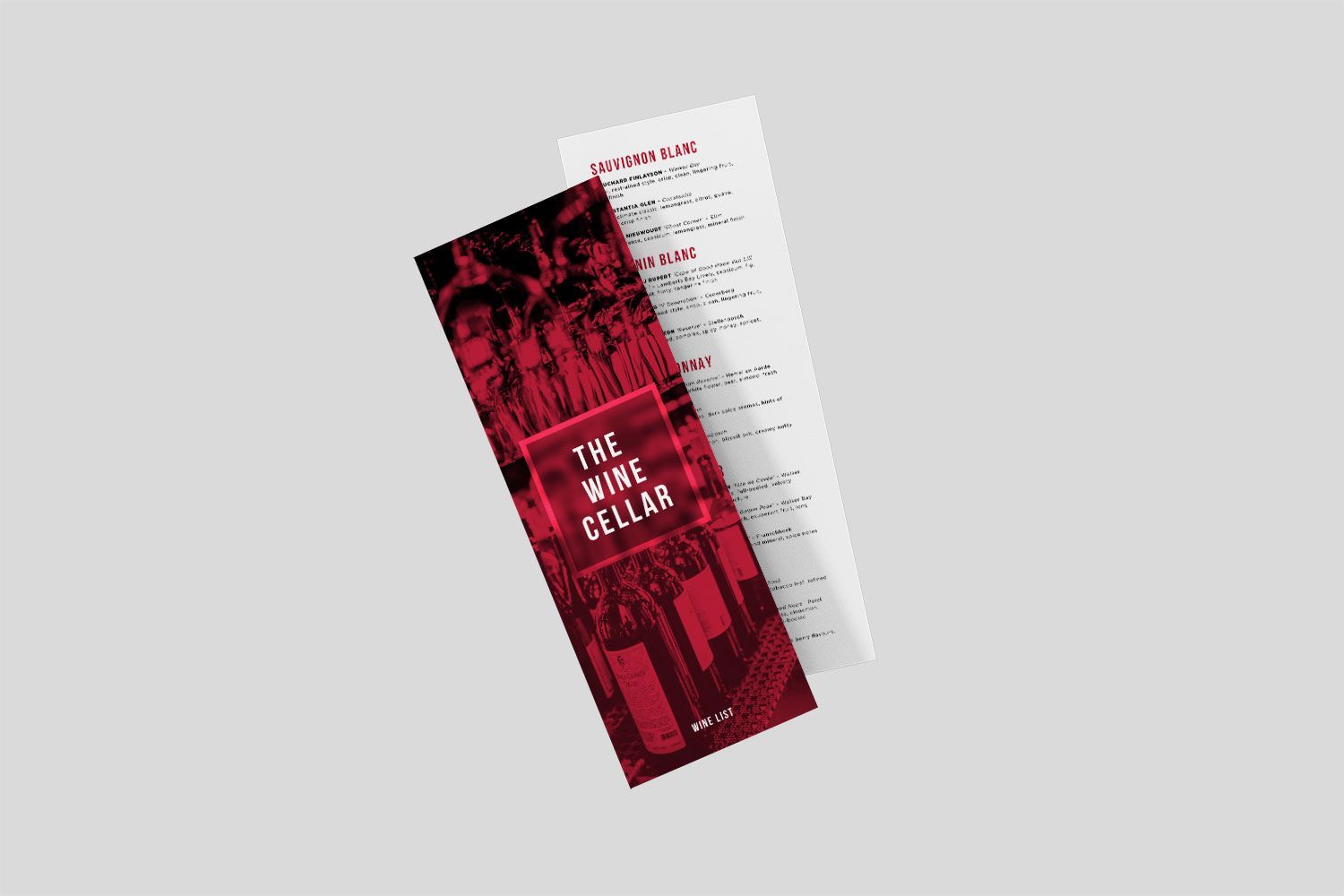 A menu for the wine cellar is sitting on a table.