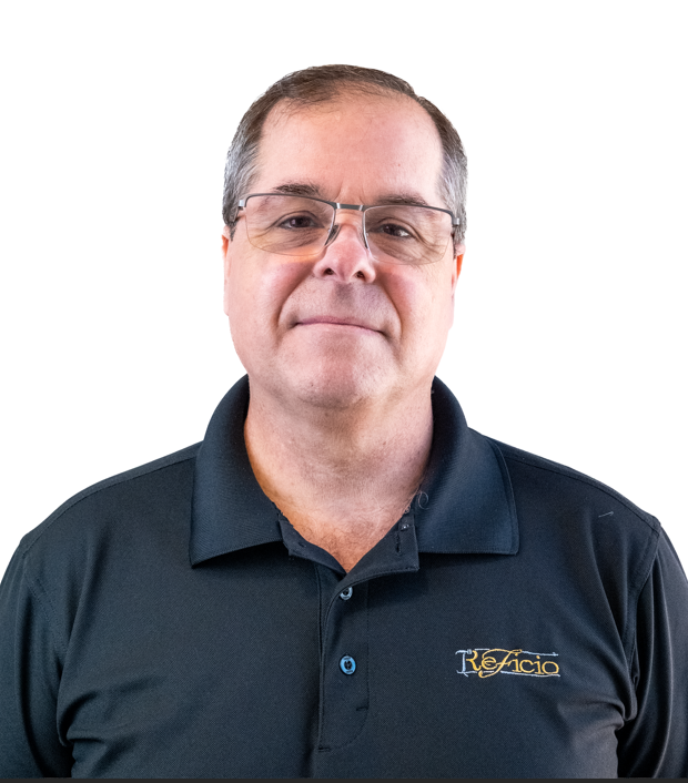 Man with glasses wearing a black polo shirt with logo.