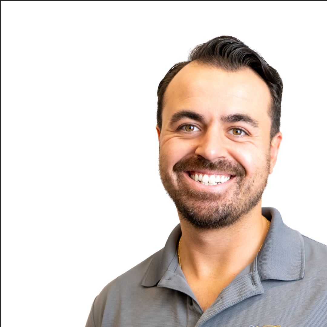 A man with a beard is smiling for the camera