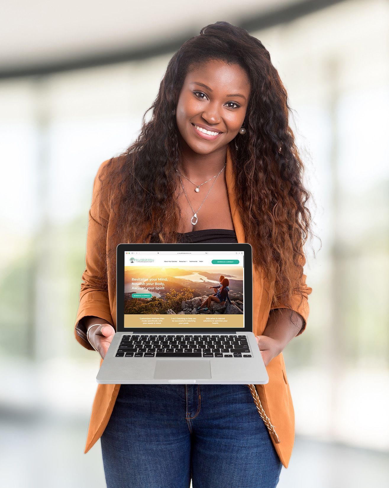 Woman holding computer showing a beautiful health professional website