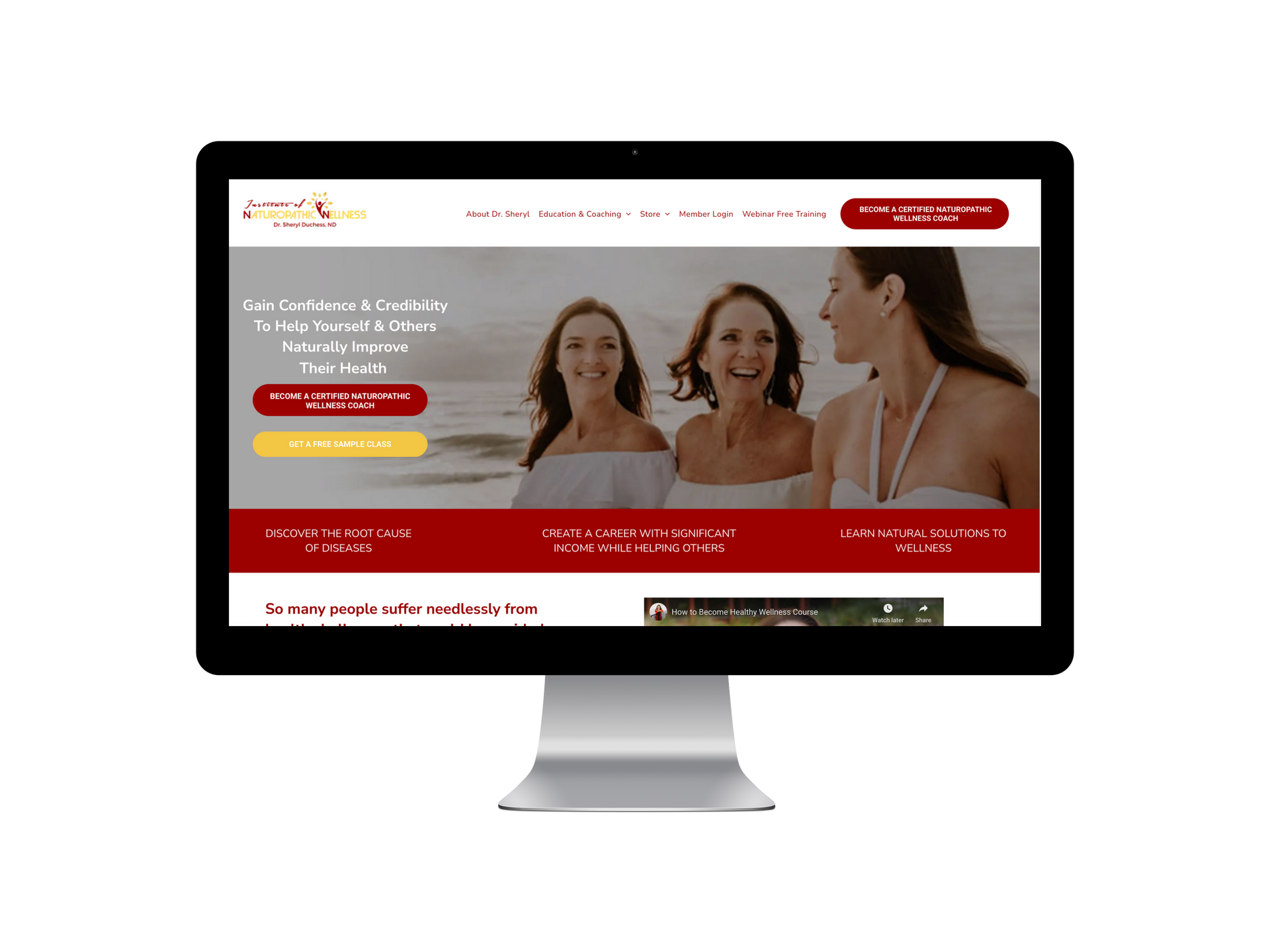 Website on a computer screen. Women smiling at the beach. Website is red and white.