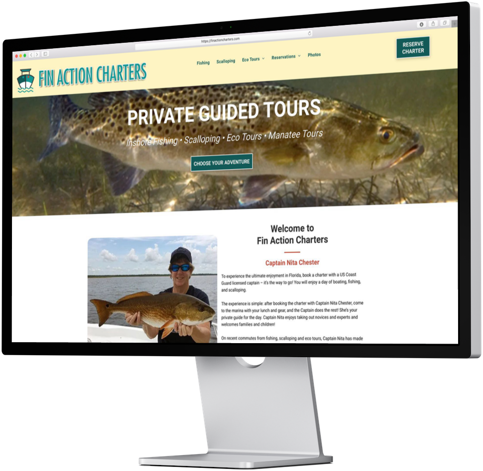 Fin Action Charters website on a desktop monitor displaying a guided tour advertisement.