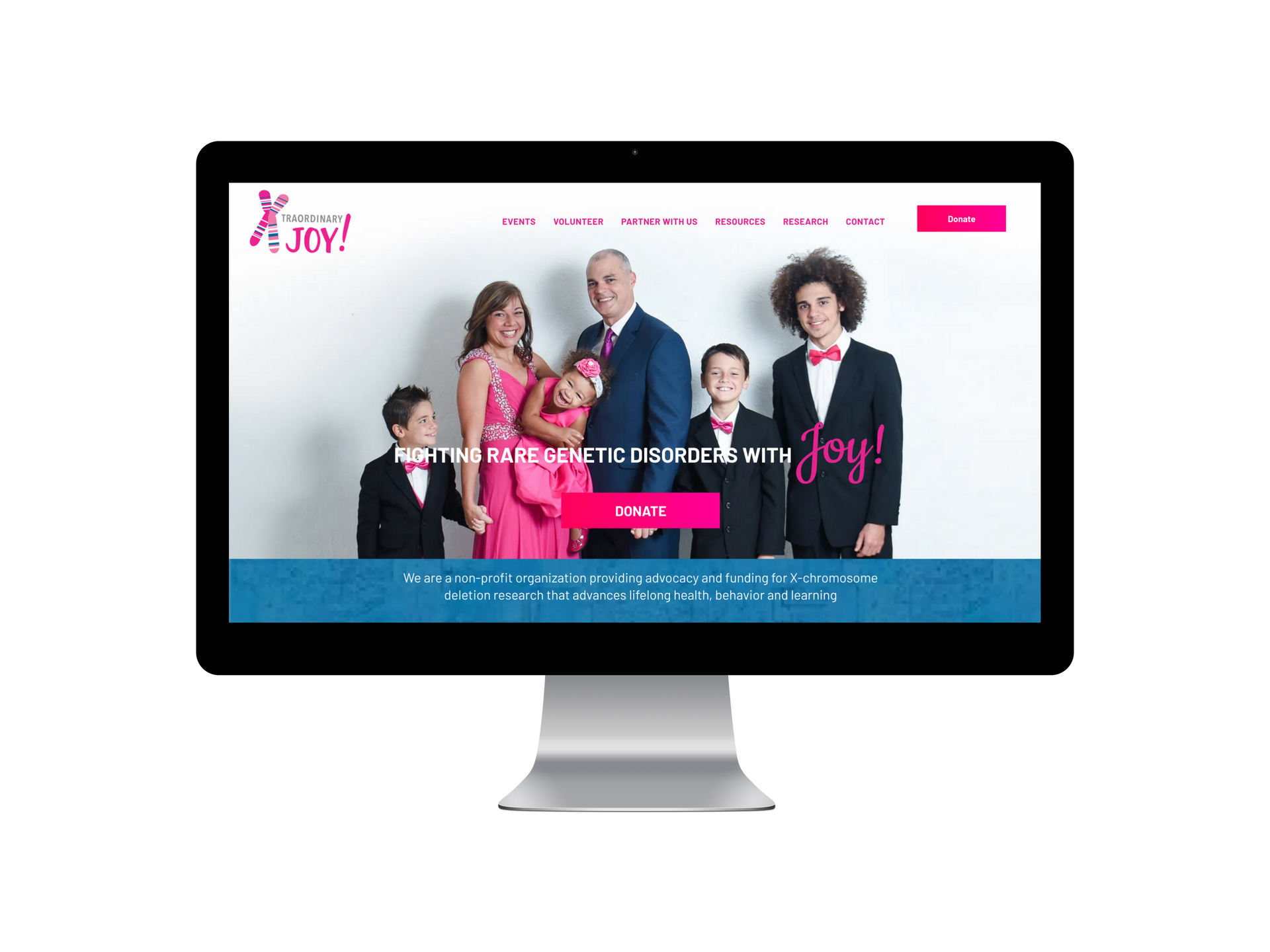 Family posing on a website, wearing formal attire. White background with pink logo.