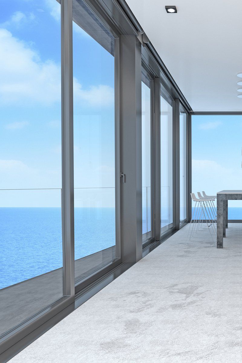 Living Room and Kitchen with Windows and View of Sea — North Geelong — Geelong Glass & Aluminium Pty Ltd Living Room and Kitchen with Windows and View of Sea — North Geelong — Geelong Glass & Aluminium Pty Ltd