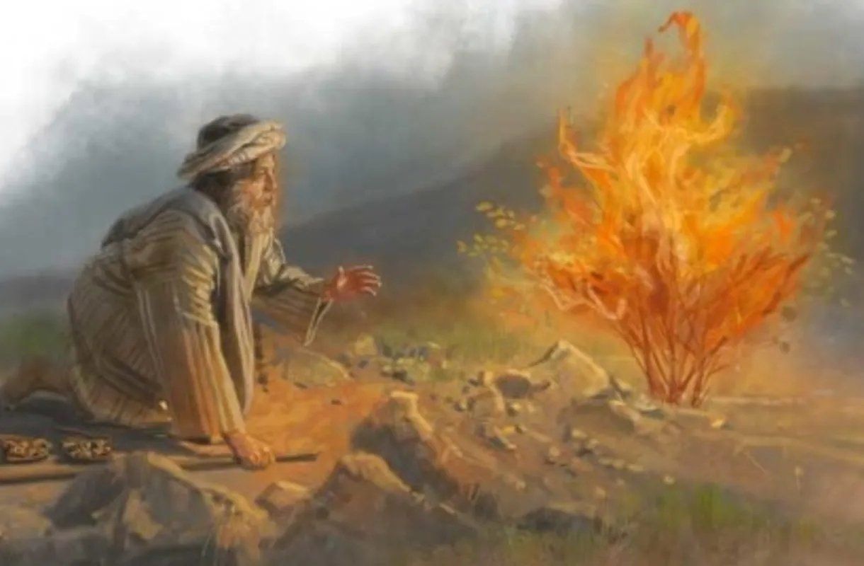 Man kneels before a burning bush in a desert setting, arms raised.