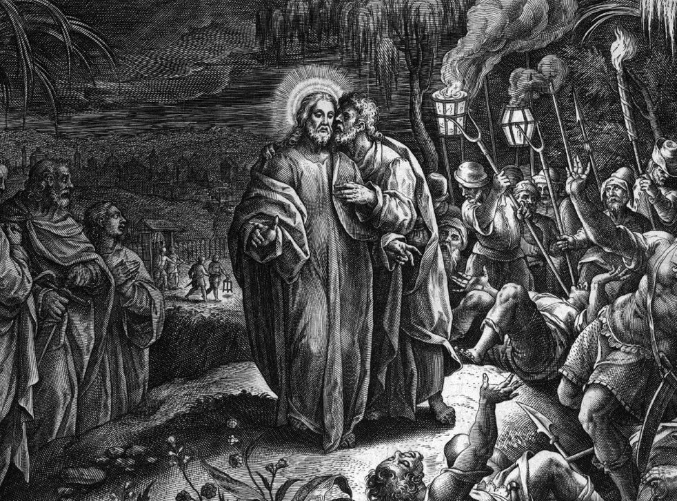 Jesus being betrayed by Judas, kissed as soldiers approach with torches, night setting.