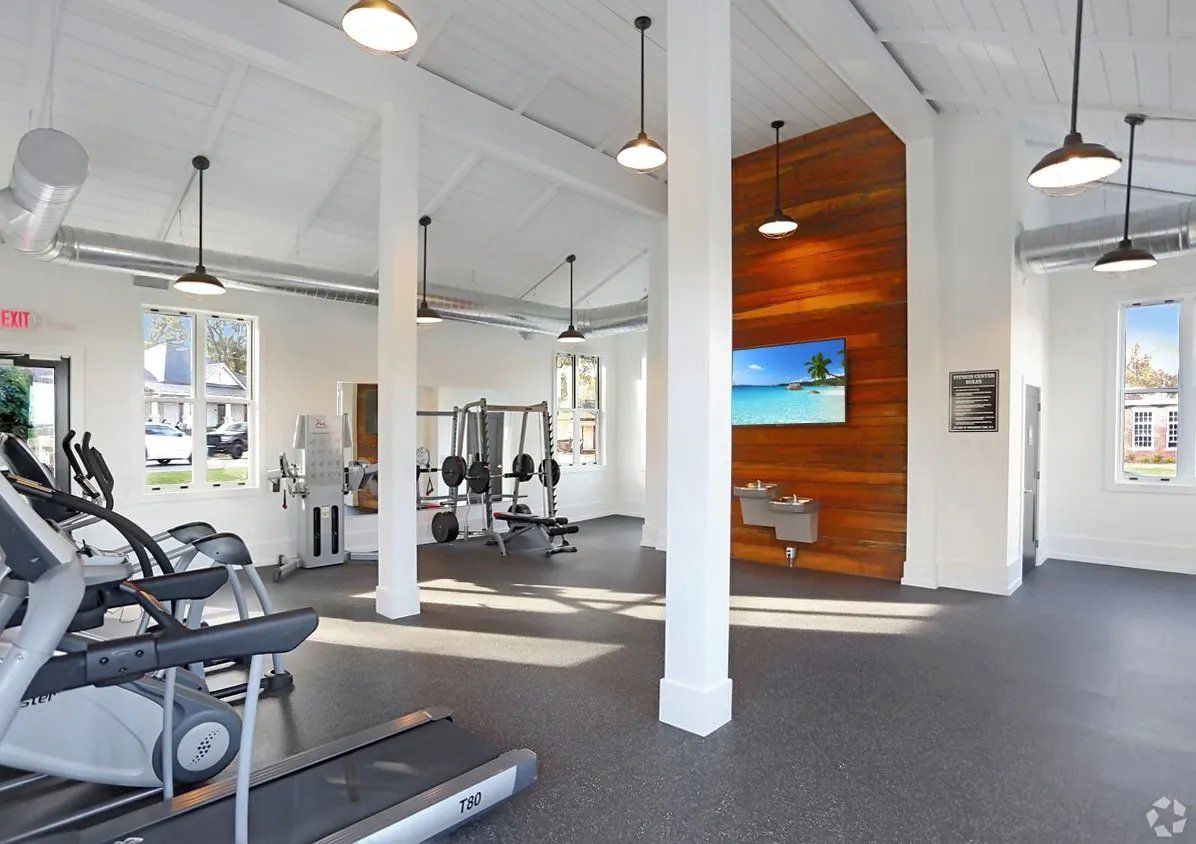 Well-equipped gym interior with cardio machines and weights. At Waxhaw Mills, our apartments for rent in Waxhaw, NC offer the best in service and enviable amenities. Experience all our community has to offer. Contact us to set up a tour!