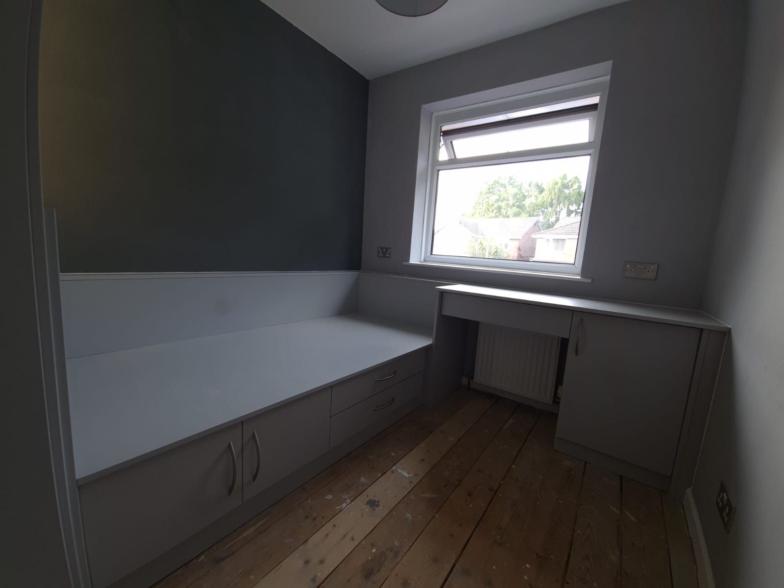 Bespoke bed in a boxroom with stair bulkhead