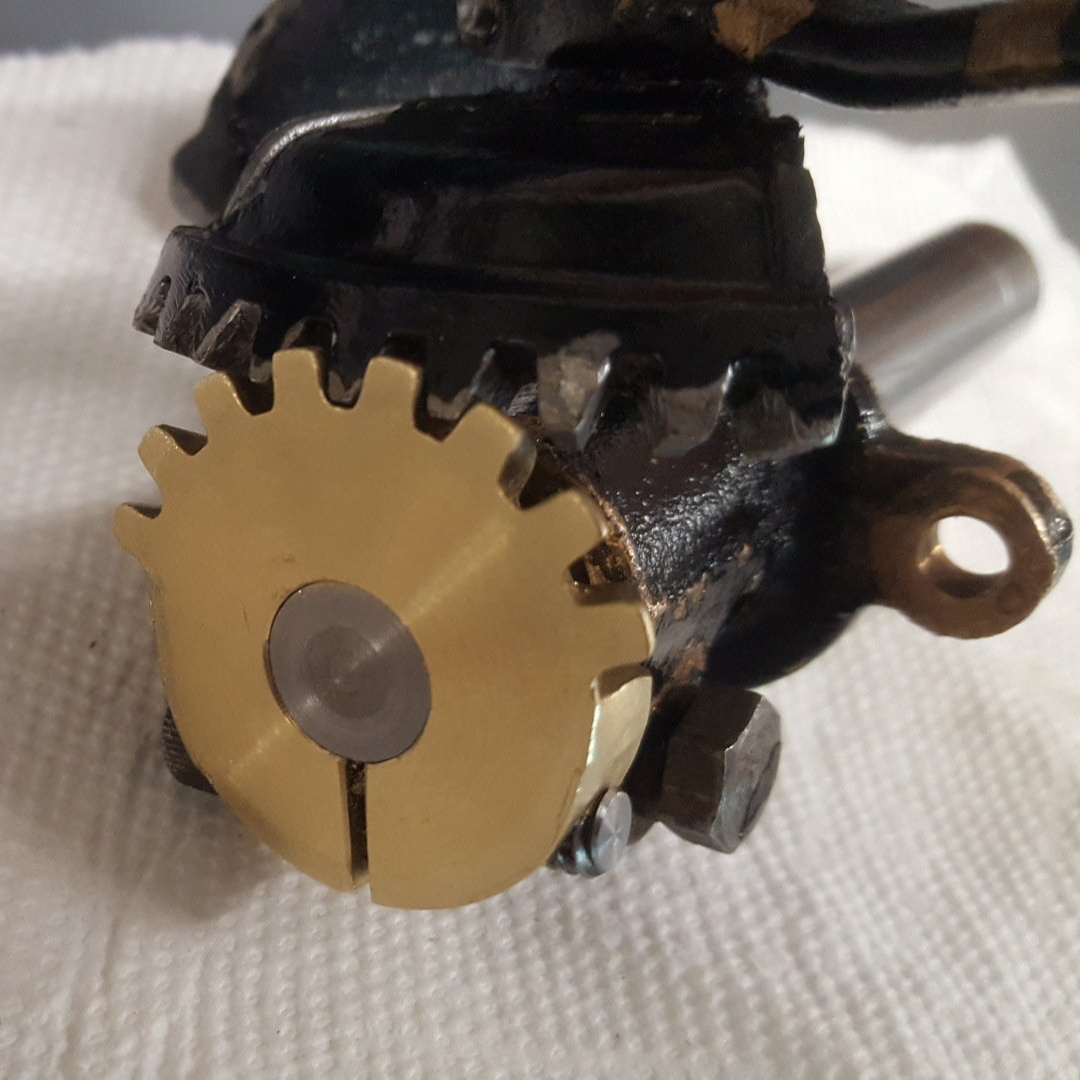 A close up of a gear on a white cloth
