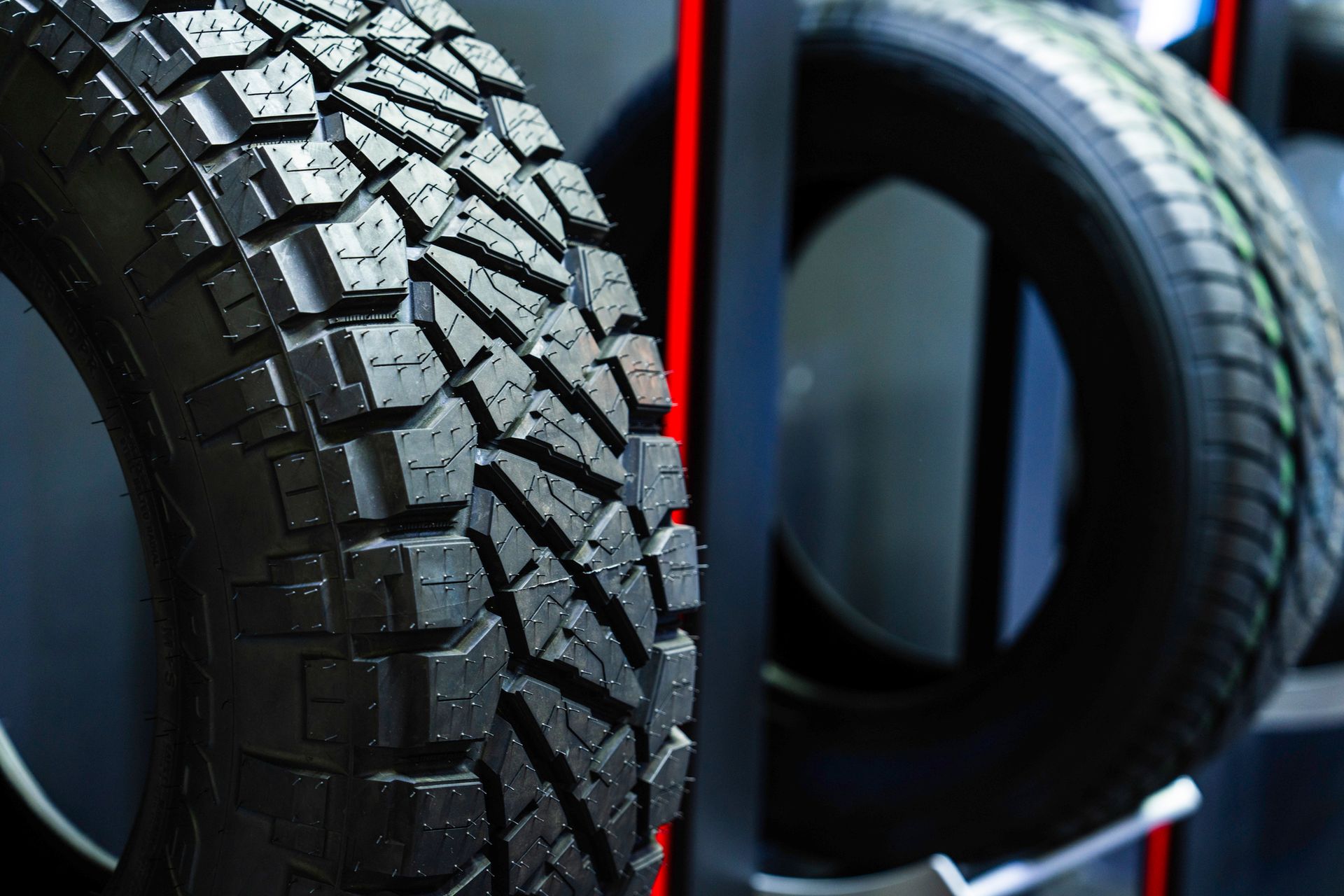 A close up of a tire on display in a store.