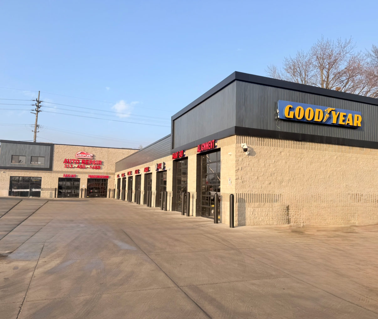 A truck is parked in front of a car wash.