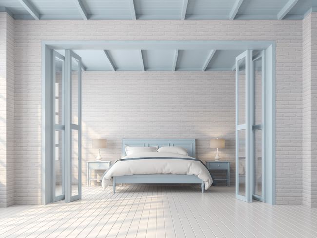 Bedroom with a light blue bed frame, doors, and ceiling. White brick walls and flooring. Bedroom with a light blue bed frame, doors, and ceiling. White brick walls and flooring.