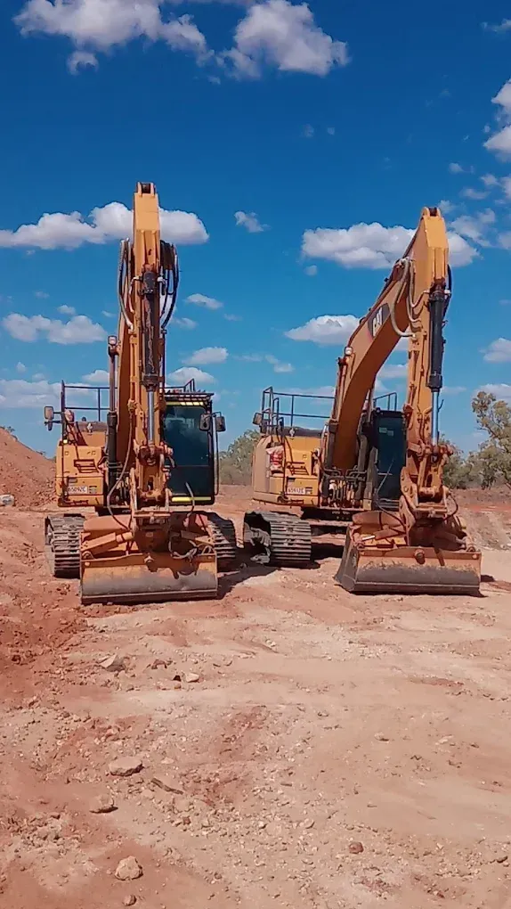 Two Yellow Excavators On Reddish-brown Dirt — Lamont Civil Services Pty Ltd In Townview, QLD