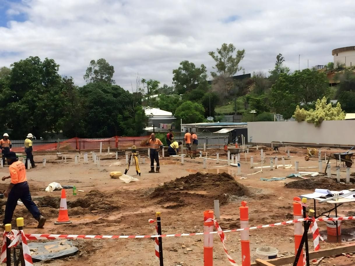 Construction Site With Workers Wearing Hard Hats, Using Equipment — Lamont Civil Services Pty Ltd In Townview, QLD