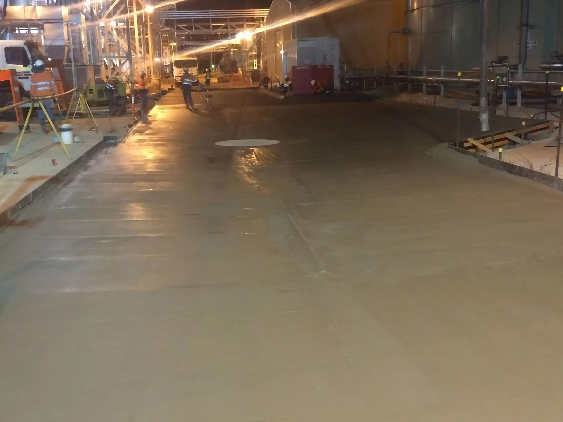 Freshly Poured Concrete Surface in an Industrial Area at Night — Lamont Civil Services Pty Ltd In Townview, QLD