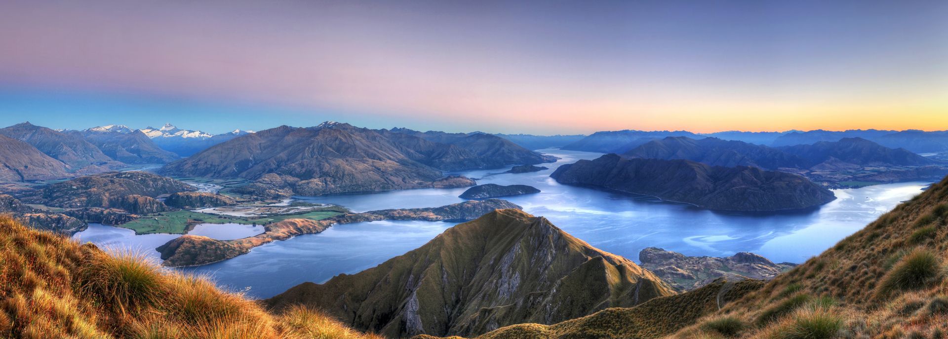 New Zealand landscape with alpine mountains and clear lake