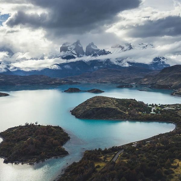 Snowcapped peaks and turquoise lake in Torres del Paine National Park, Chile.