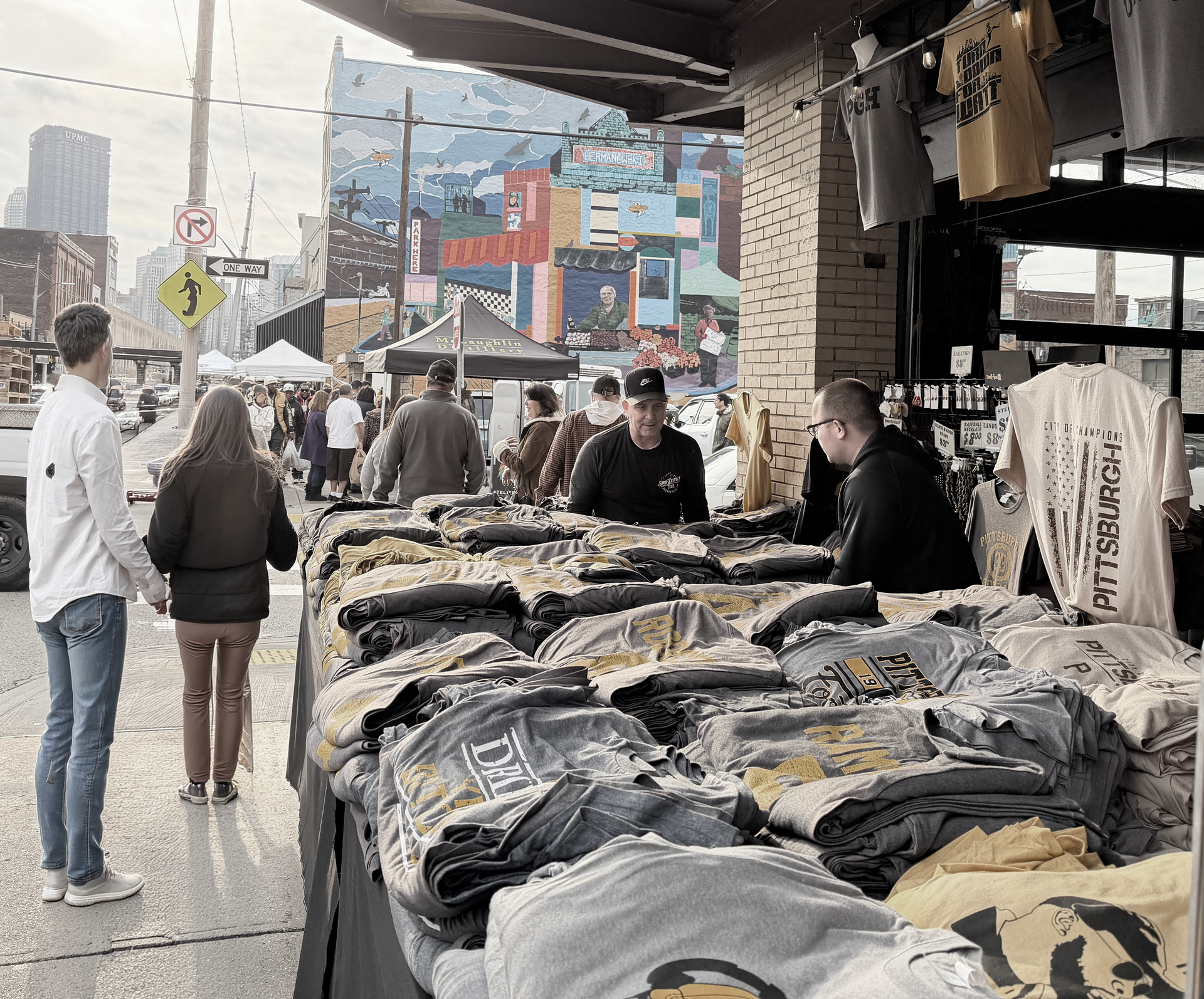 Pittsburgh Strip District market street with vendors, shops, and local food scene near downtown Pitt