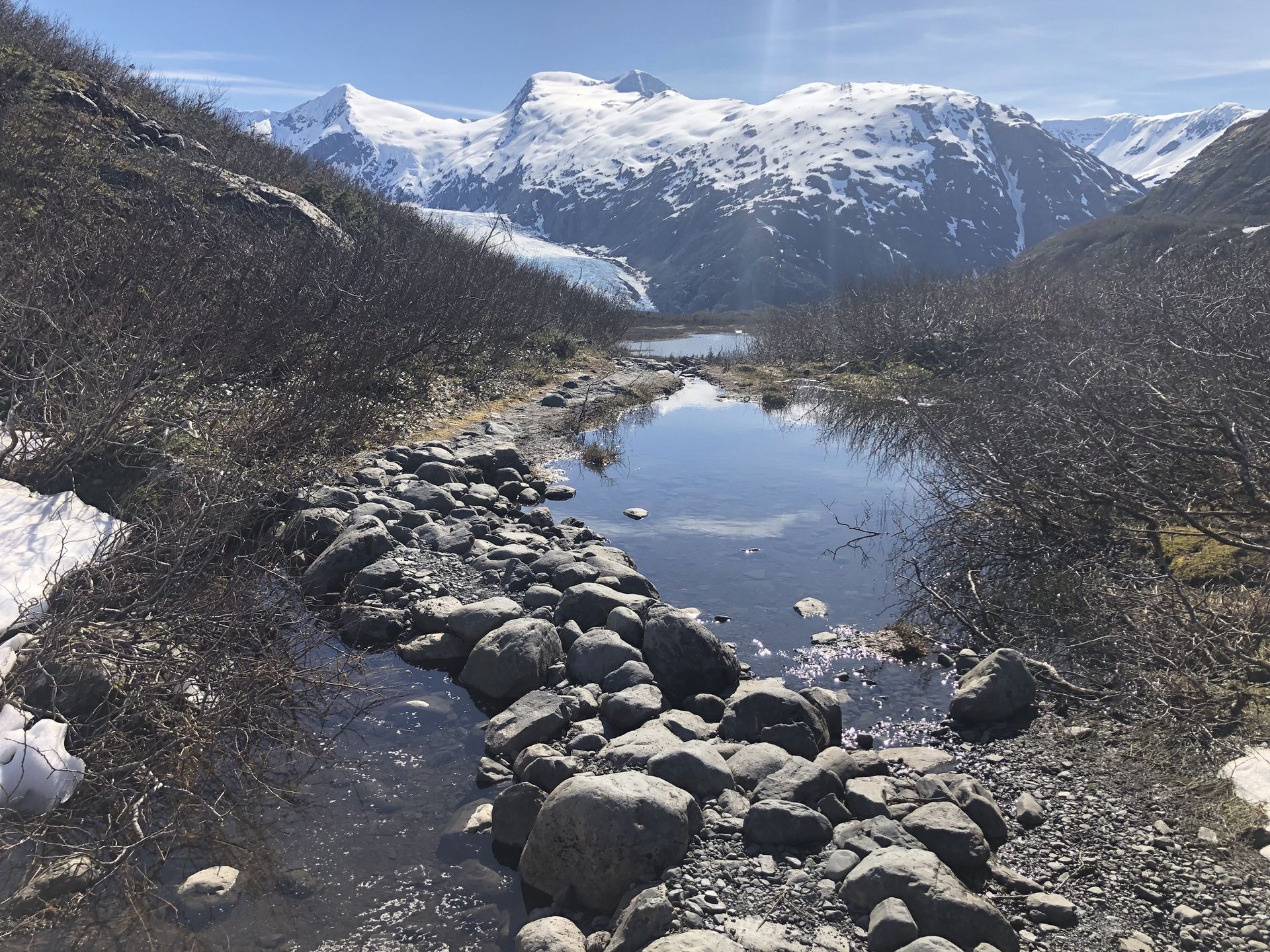 Fog drifts over Portage Glacier and Portage Lake