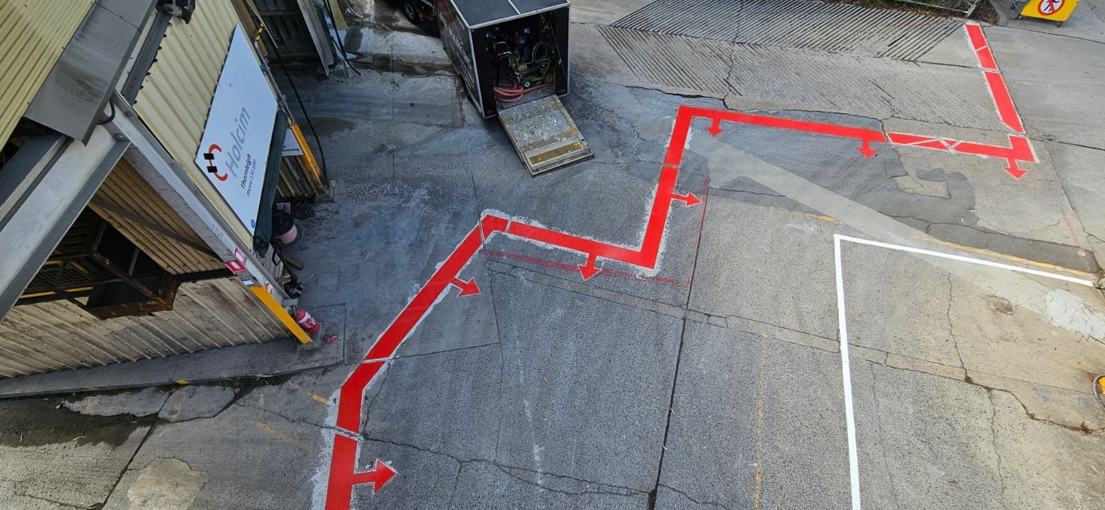Red exclusion line with red arrows at Holcim Thornleigh, seen from above